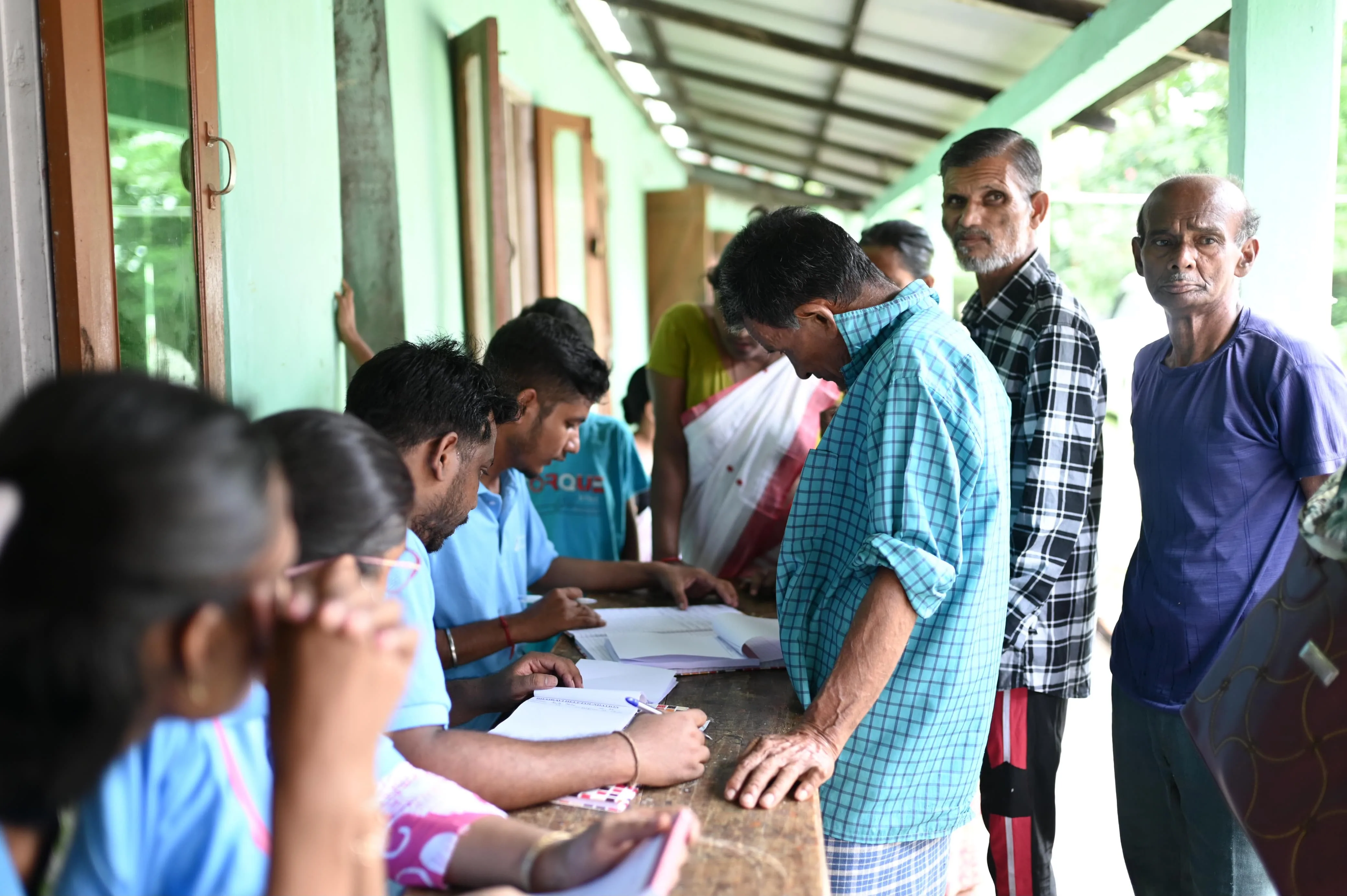 Woman receiving medical diagnosis at health camp