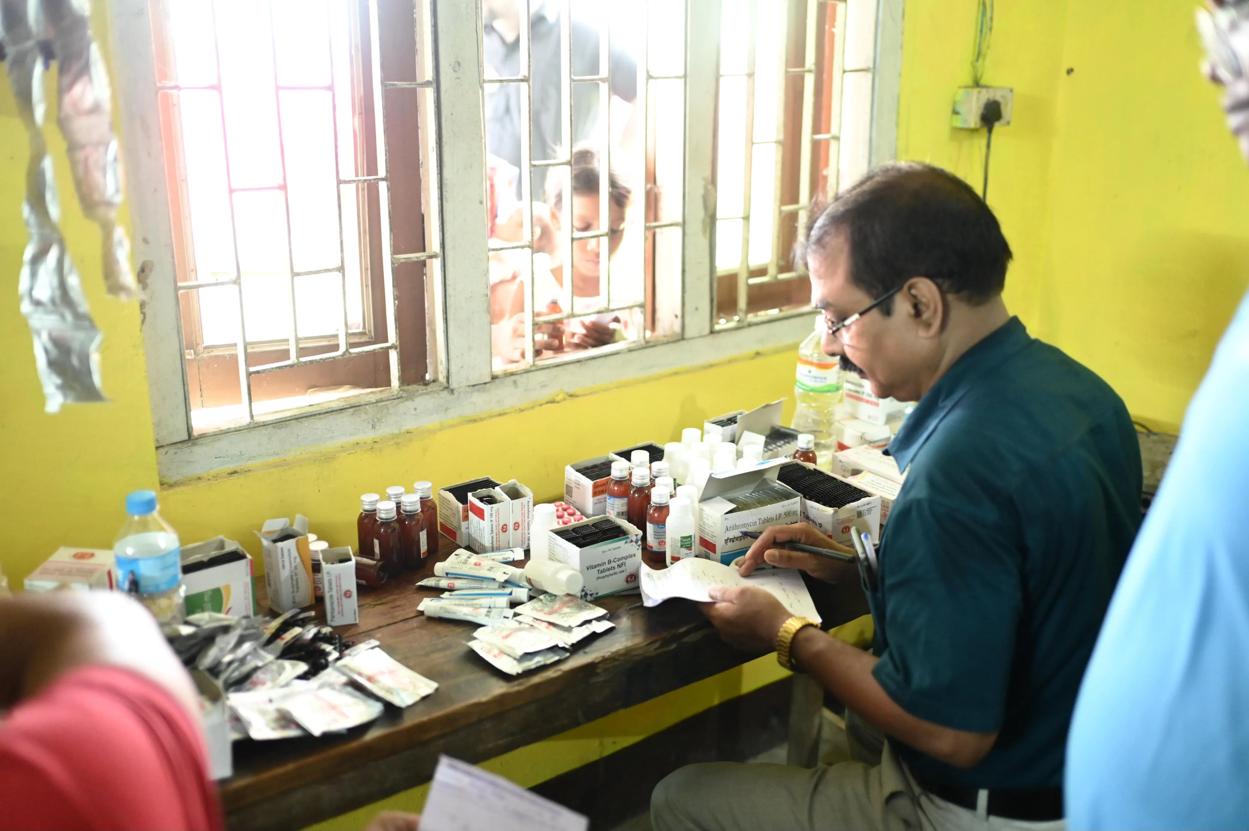 Elderly villager receiving healthcare advice