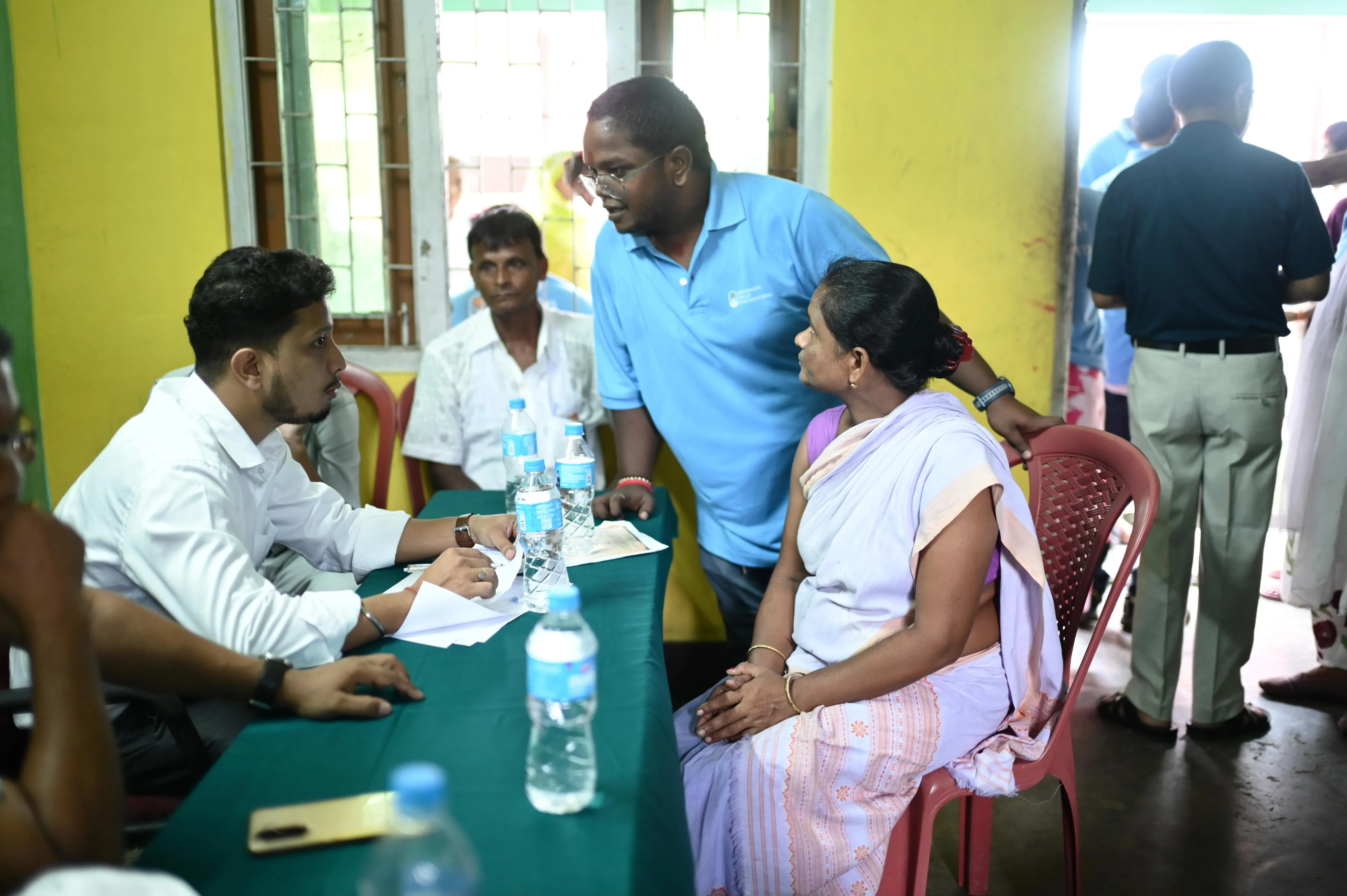 Crowd of women and children attending health camp