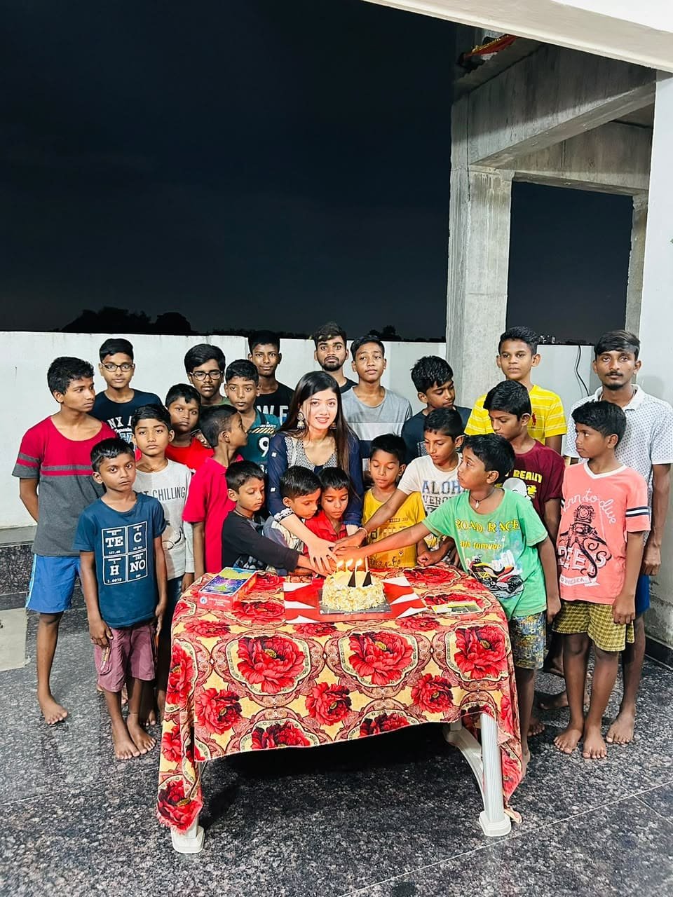 Bhairavi Aradhya Deka celebrating a birthday with children from the community