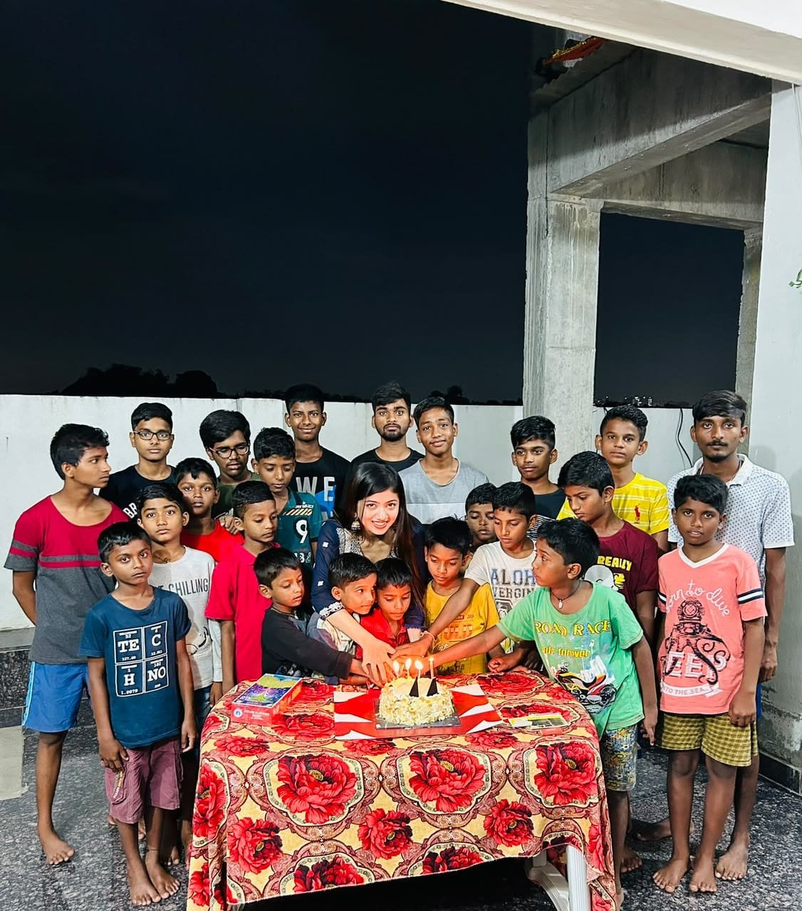 A joyful birthday moment with children during a community outreach
